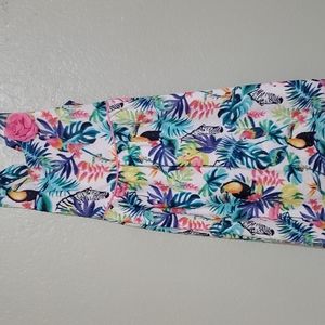 Rainforest dress with a flower and a bow.